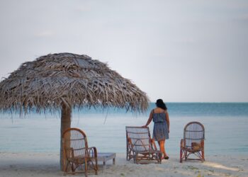 A girl standing by a beach at Lakshadweep Island