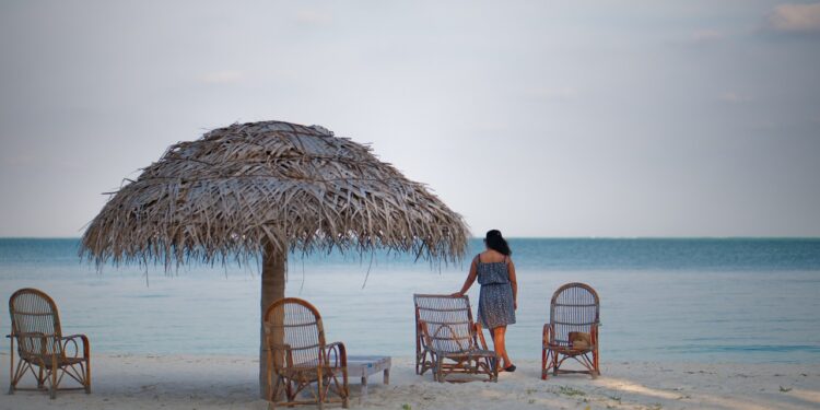 A girl standing by a beach at Lakshadweep Island